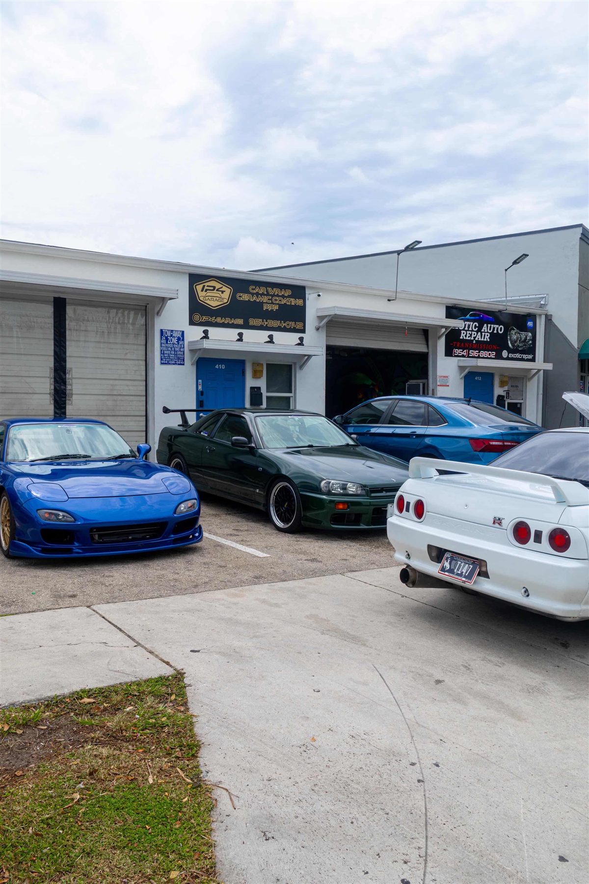Exotic Auto Repair And Transmission shop with performance cars outside