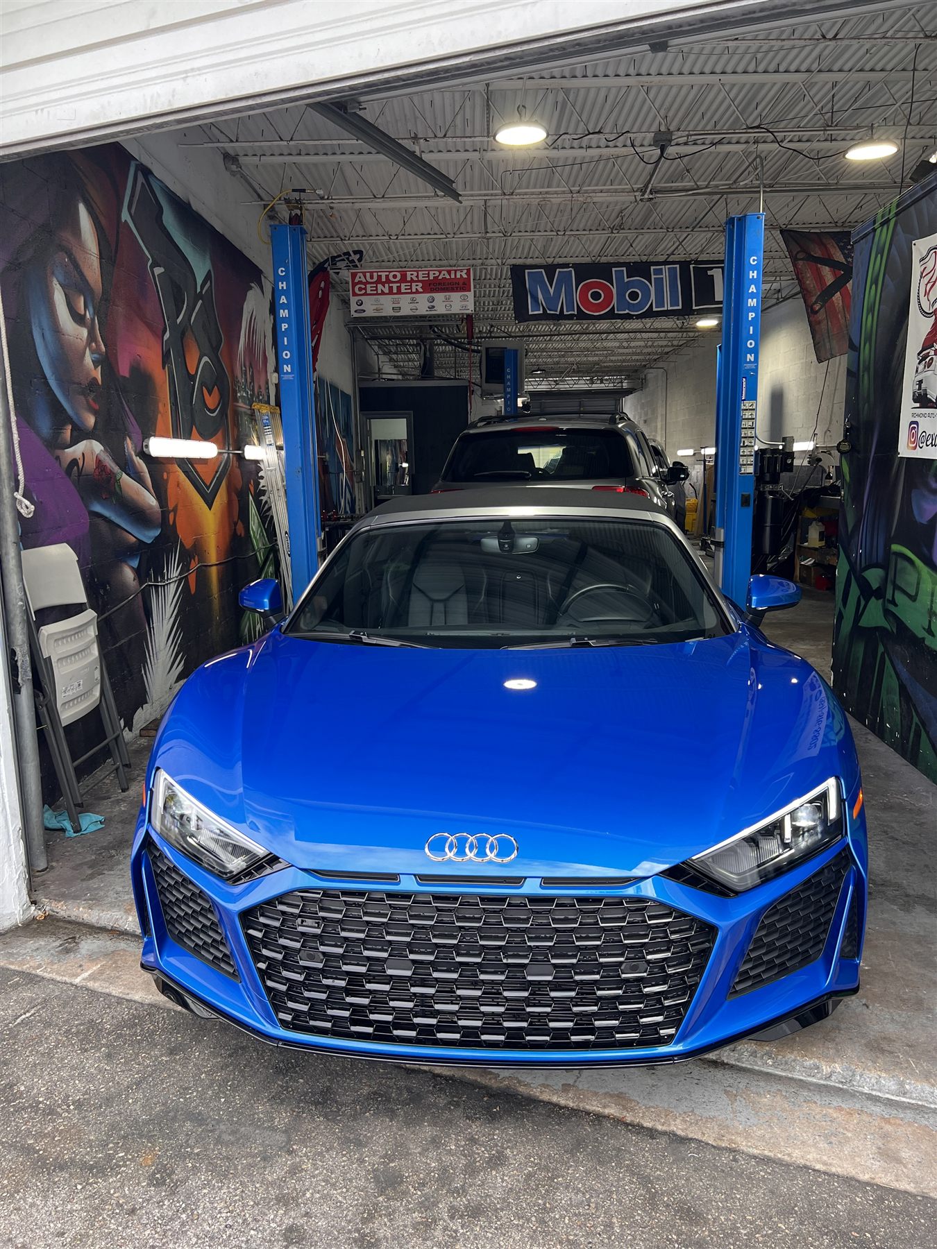 Blue Audi performance car in the service bay