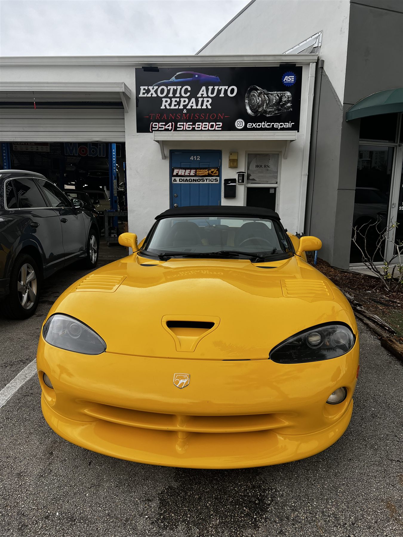 Yellow Dodge Viper outside Exotic Auto Repair And Transmission