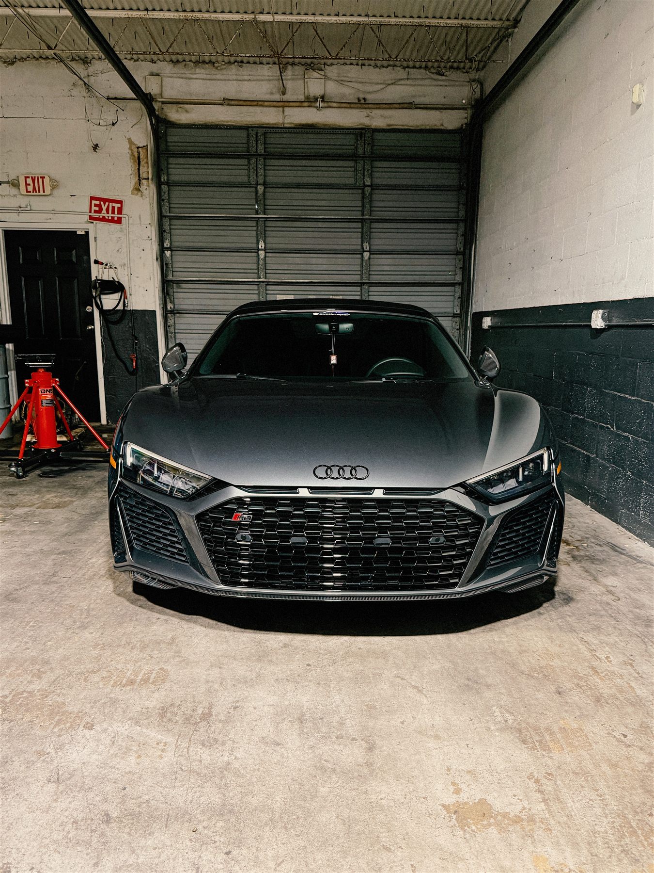 Black Audi R8 front view inside the shop