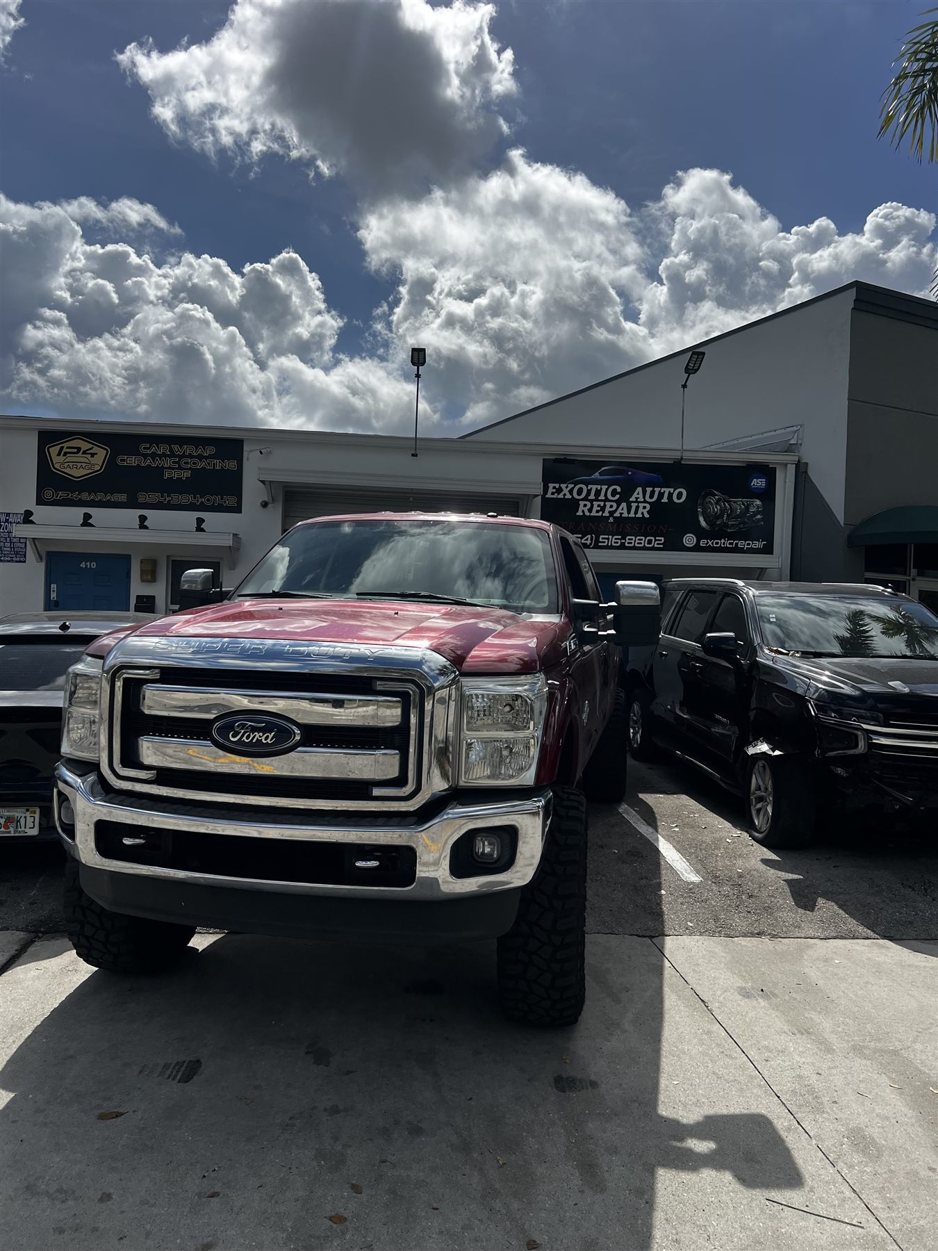 Ford truck and shop exterior at Exotic Auto Repair And Transmission